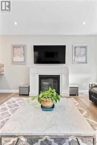 Living room with light wood-type flooring - 466 Normanton Street, Port Elgin, ON - Indoor Photo Showing Living Room With Fireplace