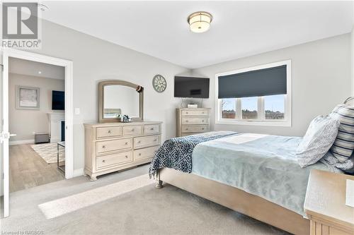 Bedroom featuring a fireplace and light hardwood / wood-style flooring - 466 Normanton Street, Port Elgin, ON - Indoor Photo Showing Bedroom