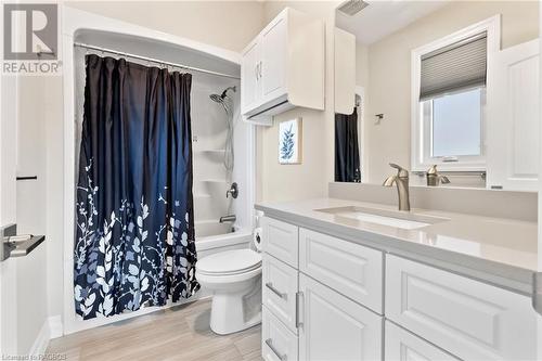 Full bathroom with a wealth of natural light, vanity, hardwood / wood-style flooring, and toilet - 466 Normanton Street, Port Elgin, ON - Indoor Photo Showing Bathroom