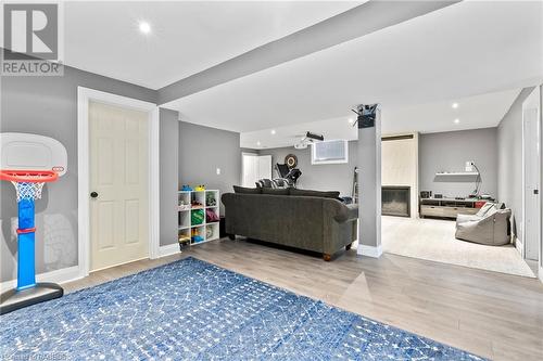 Recreation room with a fireplace and hardwood / wood-style flooring - 466 Normanton Street, Port Elgin, ON - Indoor Photo Showing Other Room