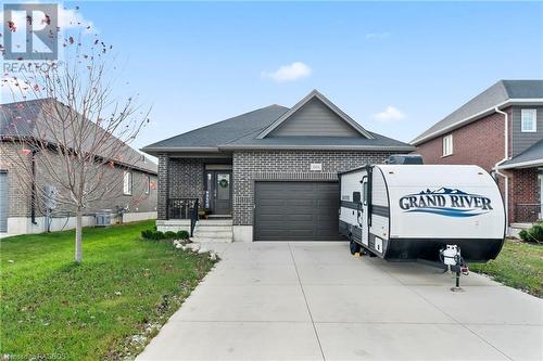 View of front of home with a front lawn and a garage - 466 Normanton Street, Port Elgin, ON - Outdoor