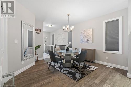 Dining area featuring dark hardwood / wood-style floors and a chandelier - 466 Normanton Street, Port Elgin, ON - Indoor Photo Showing Dining Room