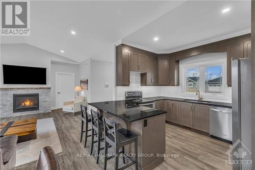 1077 Shearer Drive, Brockville (810 - Brockville), ON - Indoor Photo Showing Kitchen With Fireplace With Upgraded Kitchen