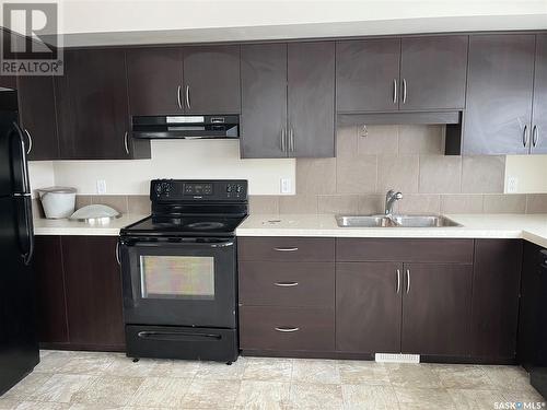 32 4533 Delhaye Way, Regina, SK - Indoor Photo Showing Kitchen With Double Sink