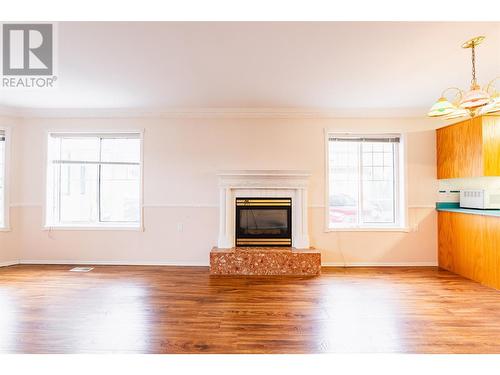 130 Chatham St Street Unit# 101, Nelson, BC - Indoor Photo Showing Living Room With Fireplace