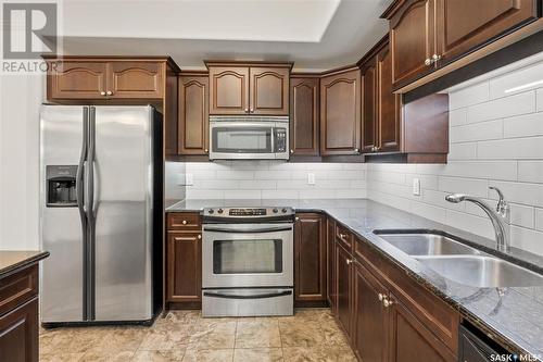 131 623 Saskatchewan Crescent W, Saskatoon, SK - Indoor Photo Showing Kitchen With Stainless Steel Kitchen With Double Sink With Upgraded Kitchen