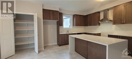 Kitchen with lots of cabinets & Pantry. Breafast Bar - 82 Green Ash Avenue, Ottawa, ON - Indoor Photo Showing Kitchen