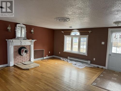 7 Tobin'S Lane, Joe Batt'S Arm, NL - Indoor Photo Showing Other Room With Fireplace