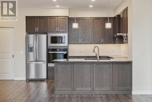 716 - 460 William Graham Drive, Aurora, ON - Indoor Photo Showing Kitchen With Stainless Steel Kitchen With Double Sink