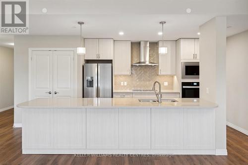 318 - 460 William Graham Drive, Aurora, ON - Indoor Photo Showing Kitchen With Double Sink