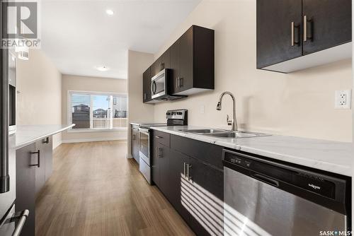 A & B 3957 James Hill Road, Regina, SK - Indoor Photo Showing Kitchen With Stainless Steel Kitchen With Double Sink With Upgraded Kitchen