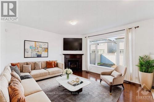 241 Dave Smith Crescent, Ottawa, ON - Indoor Photo Showing Living Room With Fireplace