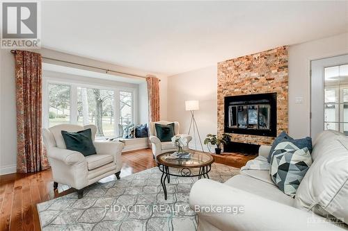 2 Kittansett Court, Ottawa, ON - Indoor Photo Showing Living Room With Fireplace