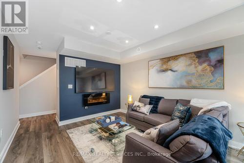 27 - 100 Dufay Road, Brampton, ON - Indoor Photo Showing Living Room With Fireplace