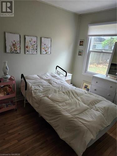 Bedroom featuring dark hardwood / wood-style floors - 765 7Th Street A E, Owen Sound, ON - Indoor Photo Showing Bedroom