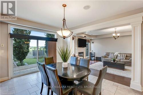 7178 St. Michael Avenue, Niagara Falls, ON - Indoor Photo Showing Dining Room With Fireplace