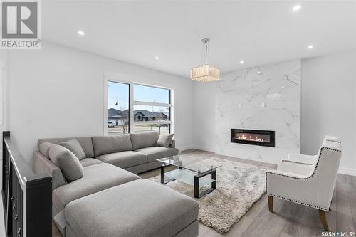 610 Weir Crescent, Warman, SK - Indoor Photo Showing Living Room With Fireplace