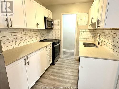 43 Taylor Avenue Unit# 106, Chatham, ON - Indoor Photo Showing Kitchen With Double Sink