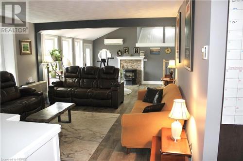 11 Rivers Road, Callander, ON - Indoor Photo Showing Living Room With Fireplace