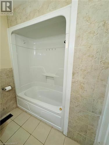 Bathroom featuring tile patterned flooring and tile walls - 49 Beaver Crescent, North Bay, ON - Indoor Photo Showing Bathroom