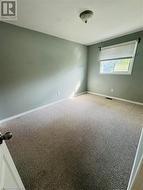 Spare room featuring carpet floors - 