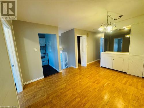 Empty room featuring light wood-type flooring and a chandelier - 49 Beaver Crescent, North Bay, ON - Indoor Photo Showing Other Room