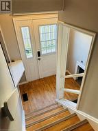 Doorway to outside featuring hardwood / wood-style floors - 