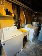 Laundry room featuring washing machine and dryer - 