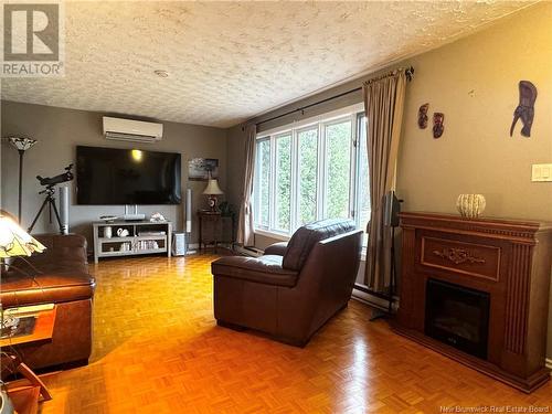 32 Du Moulin, Nigadoo, NB - Indoor Photo Showing Living Room With Fireplace