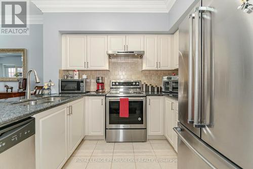 210 - 9451 Jane Street, Vaughan, ON - Indoor Photo Showing Kitchen With Double Sink