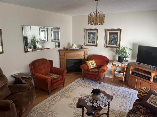 231 Durum Drive, Brandon, MB - Indoor Photo Showing Living Room With Fireplace