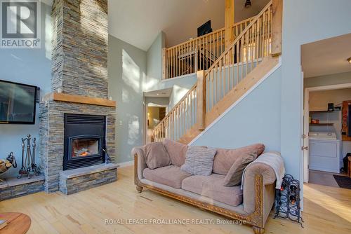 224 Island Drive Lane, South Frontenac, ON - Indoor Photo Showing Living Room With Fireplace