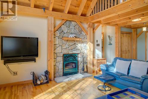 2012 Shibley Road, Central Frontenac (Frontenac Centre), ON - Indoor Photo Showing Living Room With Fireplace