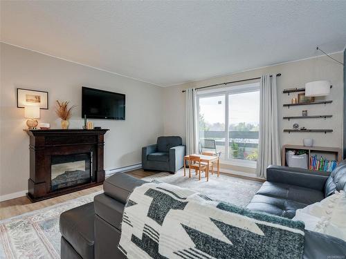 403-3235 Quadra St, Saanich, BC - Indoor Photo Showing Living Room With Fireplace