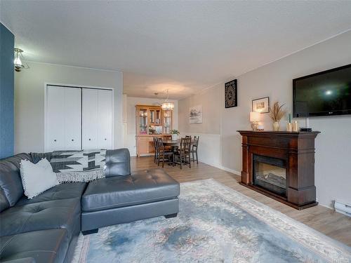 403-3235 Quadra St, Saanich, BC - Indoor Photo Showing Living Room With Fireplace