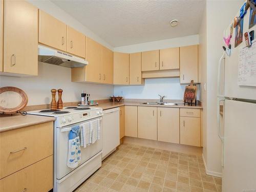 410-10030 Resthaven Dr, Sidney, BC - Indoor Photo Showing Kitchen With Double Sink