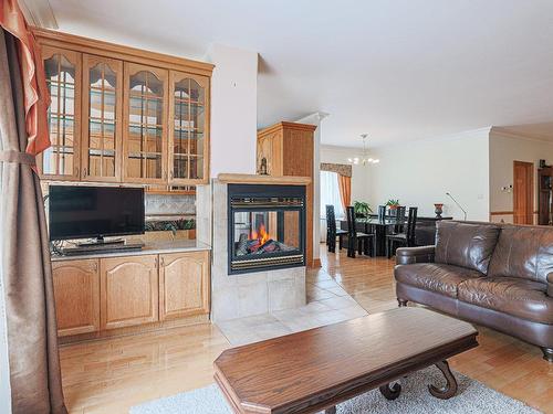 Salon - 16 Rue Duquette, Repentigny (Repentigny), QC - Indoor Photo Showing Living Room With Fireplace