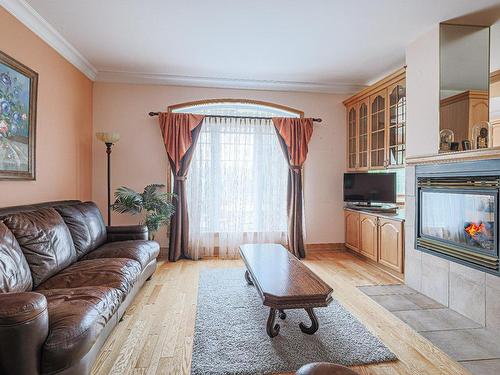 Salon - 16 Rue Duquette, Repentigny (Repentigny), QC - Indoor Photo Showing Living Room With Fireplace