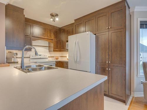 Cuisine - 301-120 Rue Ernest-Bourque, Blainville, QC - Indoor Photo Showing Kitchen With Double Sink