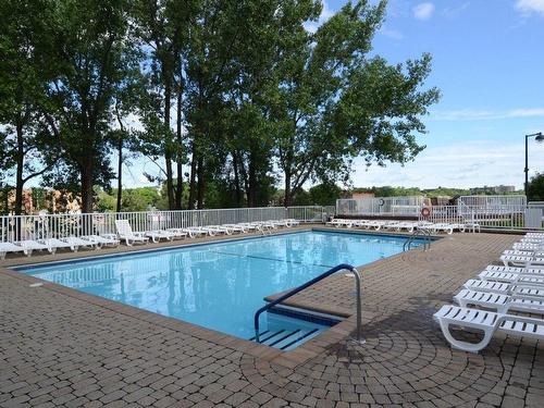 Pool - 204-500 Place Juge-Desnoyers, Laval (Pont-Viau), QC - Outdoor With In Ground Pool With Backyard