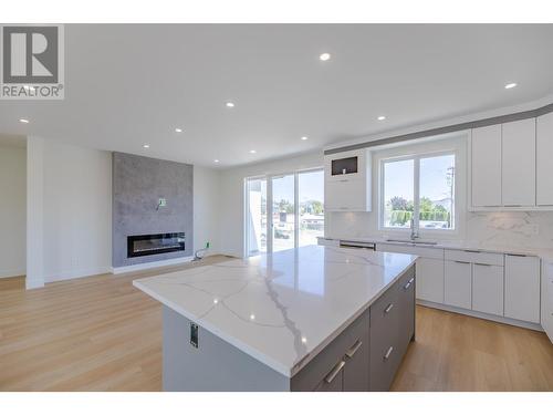 1724 Treffry Place, Summerland, BC - Indoor Photo Showing Kitchen With Fireplace