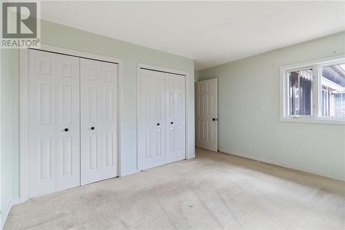 Primary bedroom on main floor with ample closet space - 118 Beley Street, Brockville, ON - Indoor