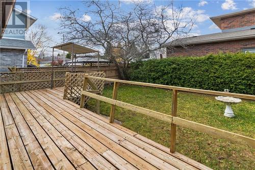 Back deck and yard with privacy hedge and fencing - 118 Beley Street, Brockville, ON - Outdoor With Deck Patio Veranda