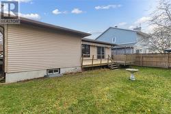 Back view of the home with enclosed fencing. - 