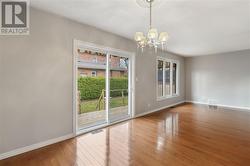 Dining room with patio door walk-out to back deck - 