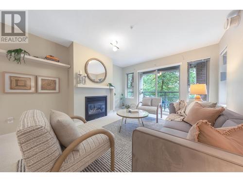 307 9319 University Crescent, Burnaby, BC - Indoor Photo Showing Living Room With Fireplace