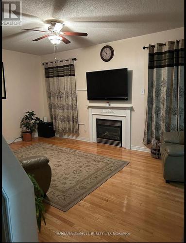 20 Midnightsun Trail, Brampton, ON - Indoor Photo Showing Living Room With Fireplace