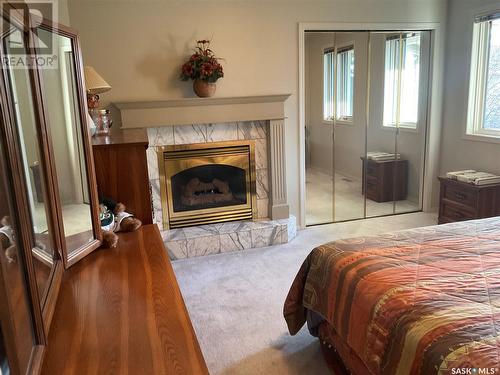 910 Braeside Place, Saskatoon, SK - Indoor Photo Showing Bedroom With Fireplace