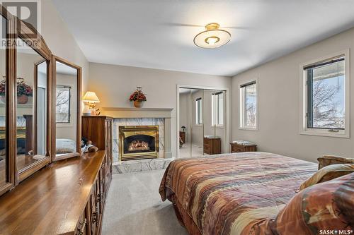 910 Braeside Place, Saskatoon, SK - Indoor Photo Showing Bedroom With Fireplace