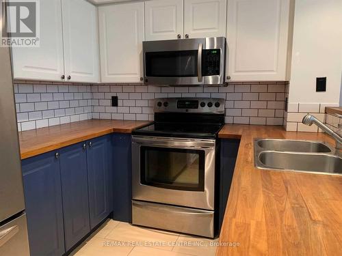 102 - 300 Manitoba Street, Toronto, ON - Indoor Photo Showing Kitchen With Stainless Steel Kitchen With Double Sink